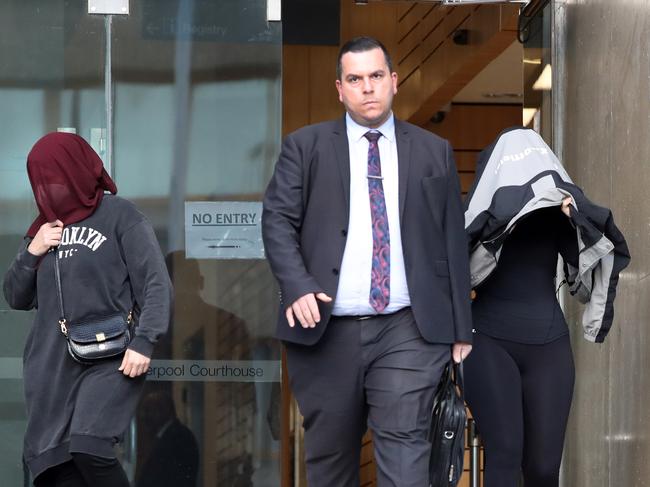 Alleged attacker Adam Kabbout’s lawyer Ihab Jamal (centre) leaves Liverpool court on Friday with the accused’s mother (left) and sister (right). Picture: Richard Dobson