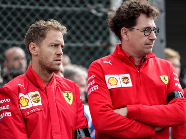 Sebastian Vettel with Ferrari's team chief Mattia Binotto.