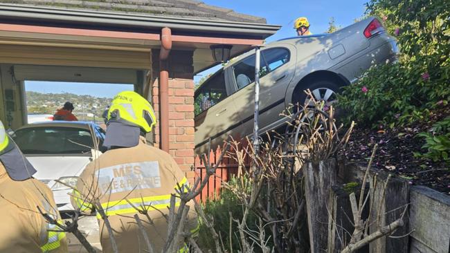 Mount Gambier SES and MFS crews at the scene after a car ploughed into the garage of a house in Mount Gambier on Tuesday. Picture: SES