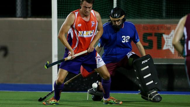 Cairns Hockey Association. Brothers v Stingers. Stingers’ Aaron Wilkes and Brothers’ goalkeeper Matthew Reichardt. PICTURE: STEWART MCLEAN