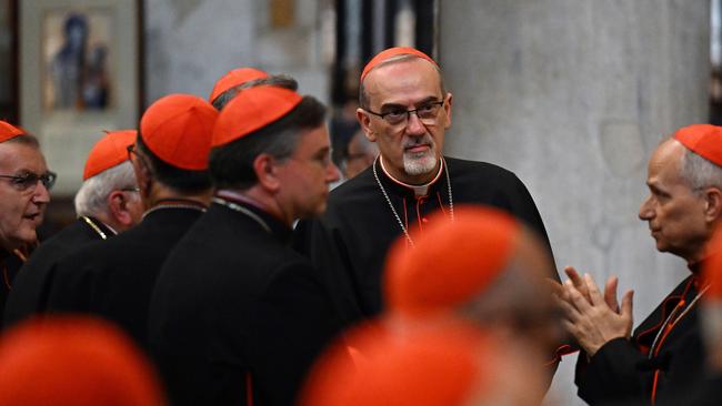 Pizzaballa, centre, among cardinals at the tomb of pope Francis in the Basilica of Saint Mary Major. Picture: Getty Images