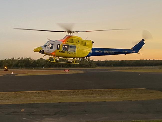 The RACQ LifeFlight helicopter lands at Hervey Bay after assisting with a fatal shark attack at Fraser Island. Picture: Cody Fox