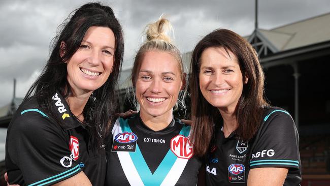 Erin Phillips, centre, with Operations Manager Rachael Sporn and head of AFLW program Juliet Haslam after signing with Port Adelaide Picture: Sarah Reed/Getty Images