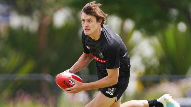 Darcy Moore runs with the ball during a Collingwood training Picture: Michael Dodge/AAP