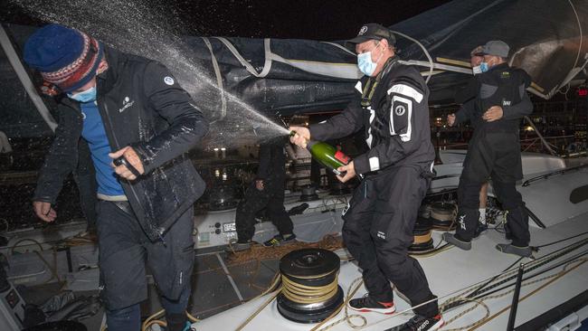 The party begins back at Constitution Dock as the crew cracks the bubbly. Picture: Chris Kidd