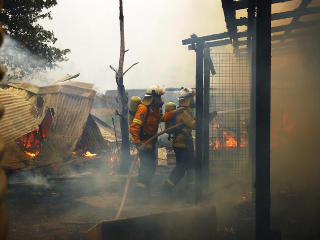 Firefighters left the safety of their shed to fight a fire that threatened their water supply. Picture: Sam Ruttyn