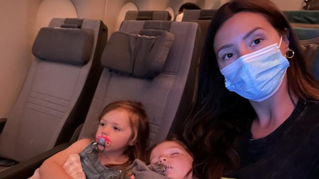 Joanna Burgess and daughters Blainey and Birdie flew back to Sydney from the UK. Picture: Supplied