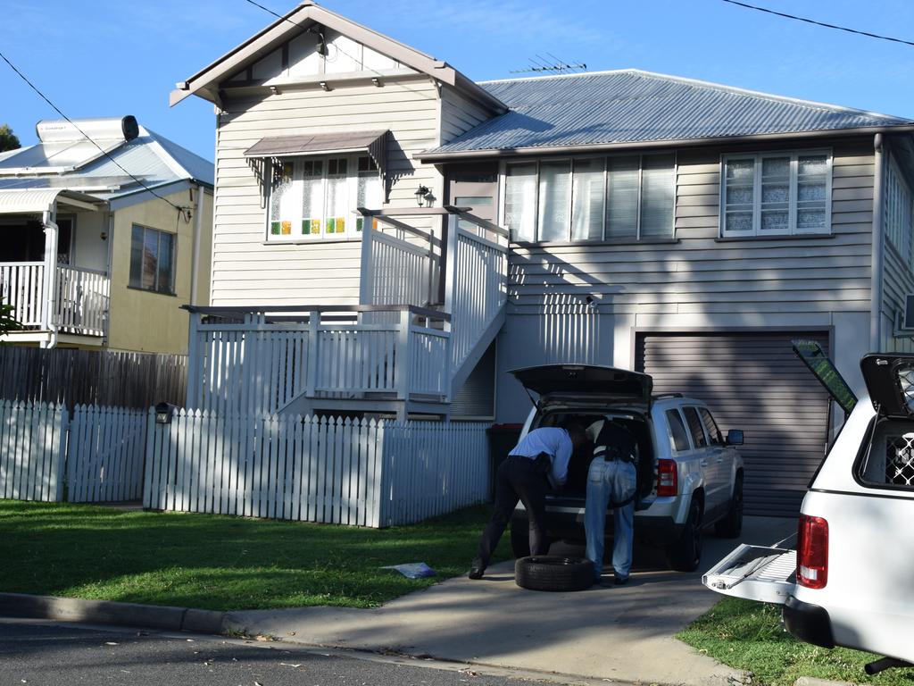 Police conducting searches at a home on Hardacre St in Wandal on February 19, 2020. The vehicles were later impounded.