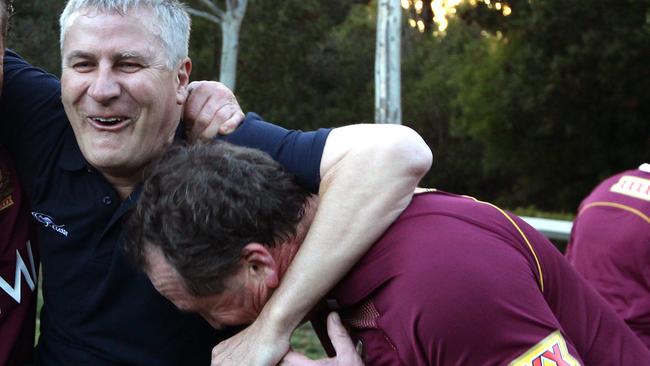 Michael McCormack and Barnaby Joyce having fun after a touch football game in in Canberra.