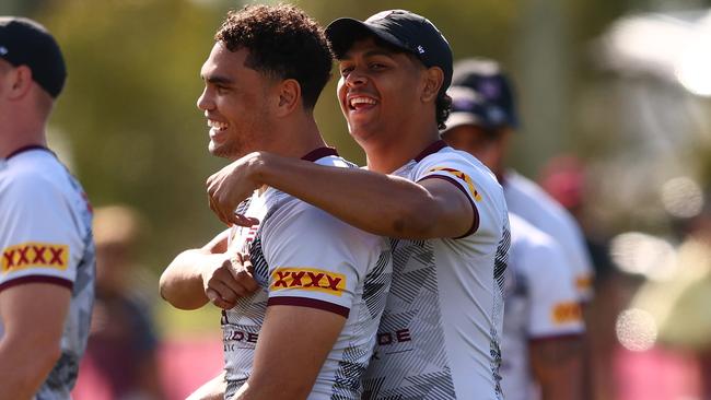 Selwyn Cobbo, right, shares a laugh with Maroons teammates Xavier Coates in camp. Picture: Chris Hyde/Getty Images