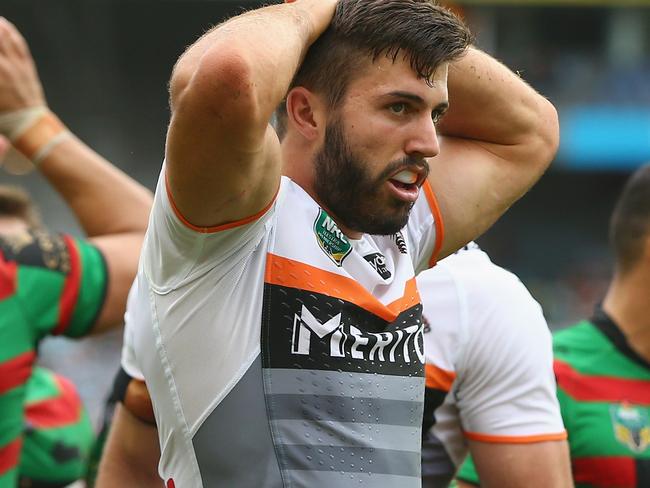 SYDNEY, AUSTRALIA - MARCH 22: James Tedesco of the Tigers looks dejected after a Rabitohs try during the round three NRL match between the South Sydney Rabbitohs and the Wests Tigers at ANZ Stadium on March 22, 2015 in Sydney, Australia. (Photo by Mark Kolbe/Getty Images)