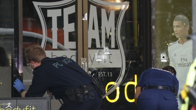 Forensic officers outside the popular gym that is situated on the busy Parramatta Rd in Auburn. Picture: John Grainger