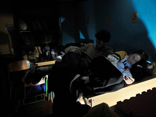 People hide in a bomb shelter in Kyiv as Russia attacks the city. Picture: AFP.