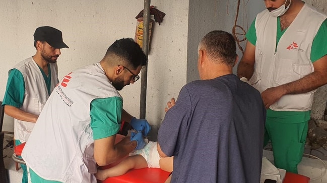 MSF medical staff apply a dressing to a young child at the MSF Burns Clinic in central Gaza after he suffered from severe burns in an air strike. Gaza, 19 October 2023. Picture: MSF