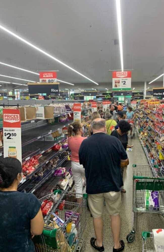 Long lines of people in aisles at Woolworths Ashgrove. Photo: Bianca Hrovat