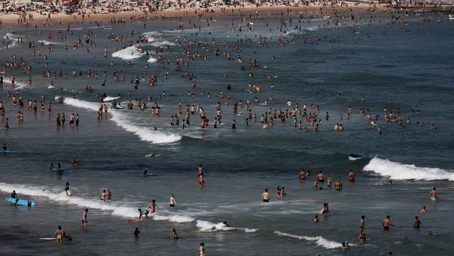 Swimmers and sunbathers at Bondi Beach. Pic: Paul Blackmore.