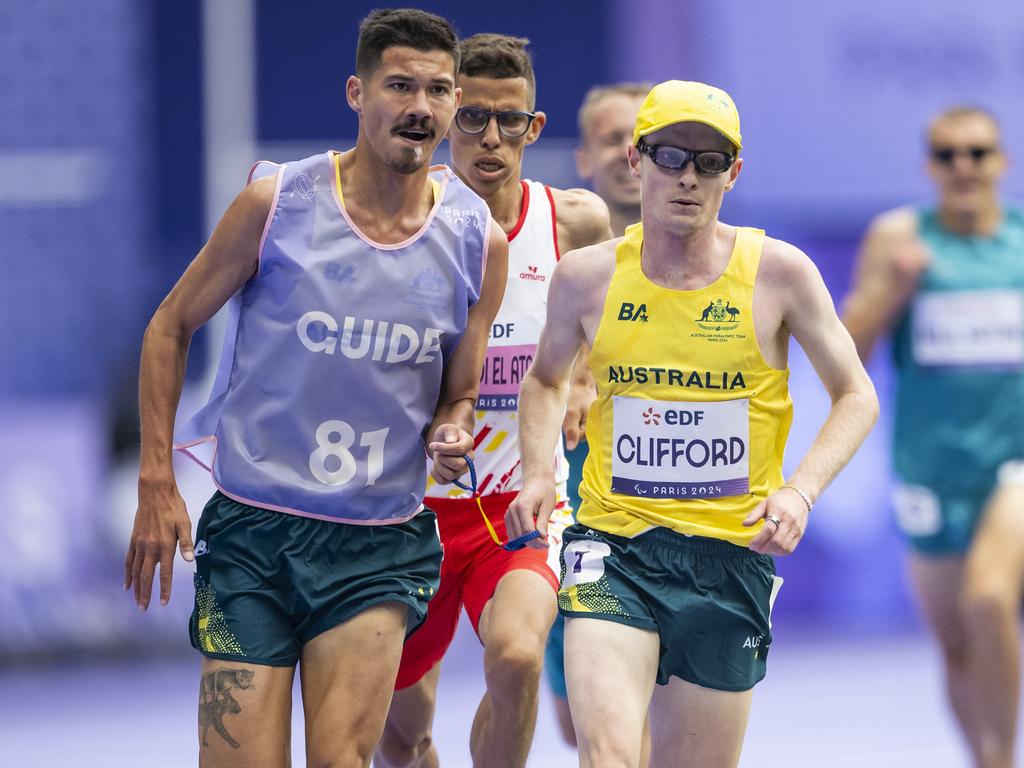 Clifford (R) and Clarke (L) followed by Ouhdadi in the 5000m T13 final in Paris. Picture: Tom Weller/VOIGT/GettyImages