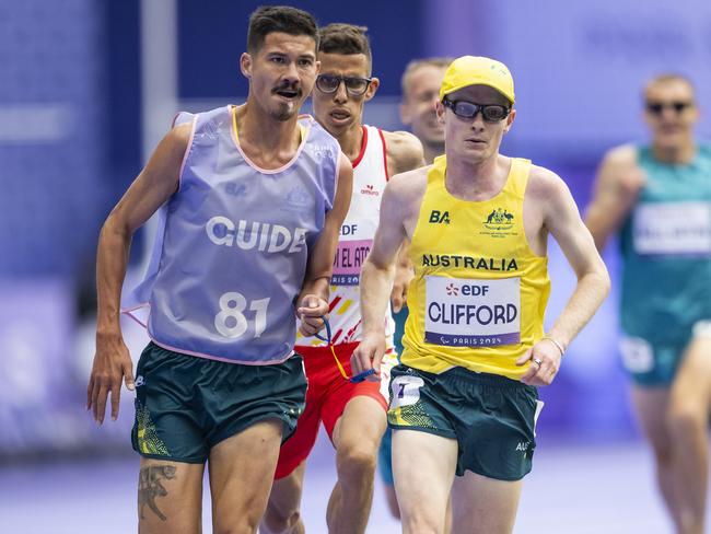 Clifford (R) and Clarke (L) followed by Ouhdadi in the 5000m T13 final in Paris. Picture: Tom Weller/VOIGT/GettyImages