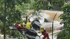 Swift water rescue crews worked to rescue three children from the swollen Woree Creek. Picture: Supplied