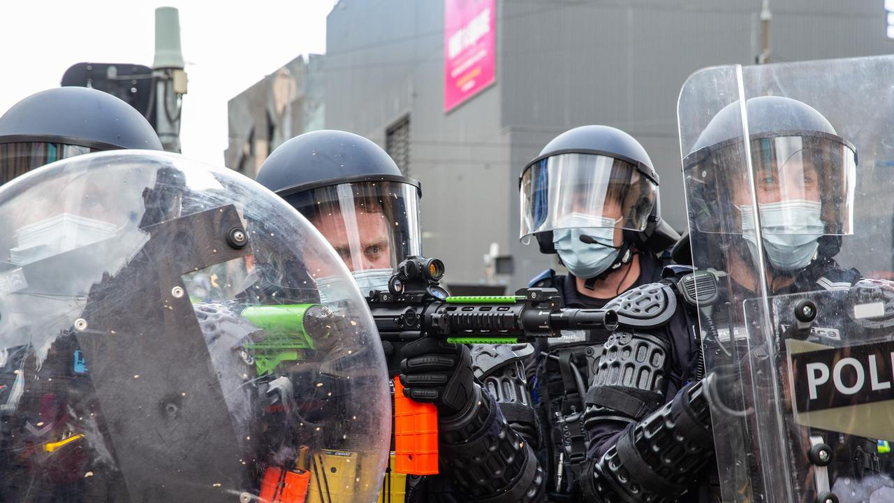 Police fire non-lethal ordinance into the crowd of Freedom Rally protestors in the CBD. Picture: NCA NewsWire/Sarah Matray