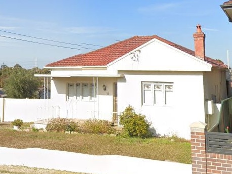 The house at Prairie Vale Rd, Bankstown was allegedly being used as a gun and drug storage facility.