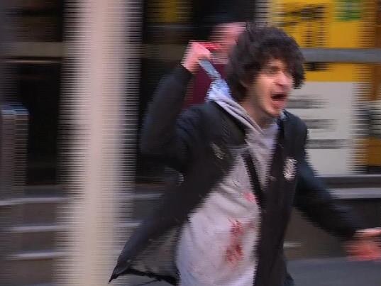 The man runs through Sydney’s CBD. Picture: Seven News