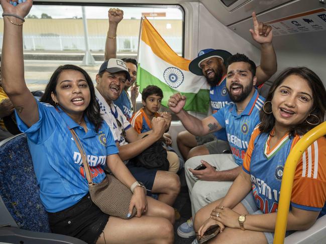 Families from Harris Park Cricket Club travelling together on the train to the SCG for the first day of the Pink Test. Picture: Monique Harmer