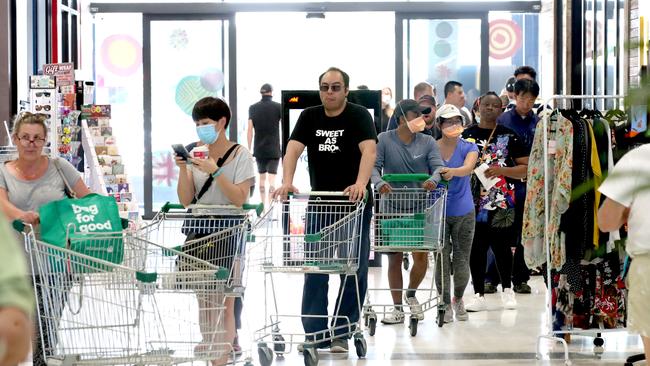 People queuing at Woolworths at West Torrens in Adelaide this afternoon. Picture: Kelly Barnes/Getty Images