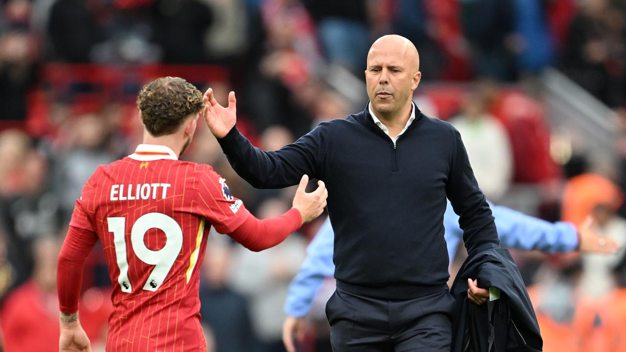 Arne Slot, Manager of Liverpool, interacts with Harvey Elliott of Liverpool after the Premier League match between Liverpool FC and Brentford FC at Anfield on August 25, 2024 in Liverpool, England. (Photo by Michael Regan/Getty Images)