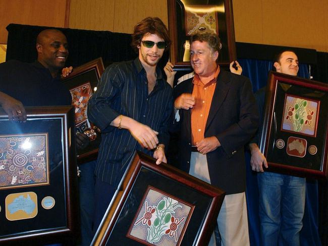 Jamiroquai with their double platinum awards presented by Denis Handlin. Picture: AAP