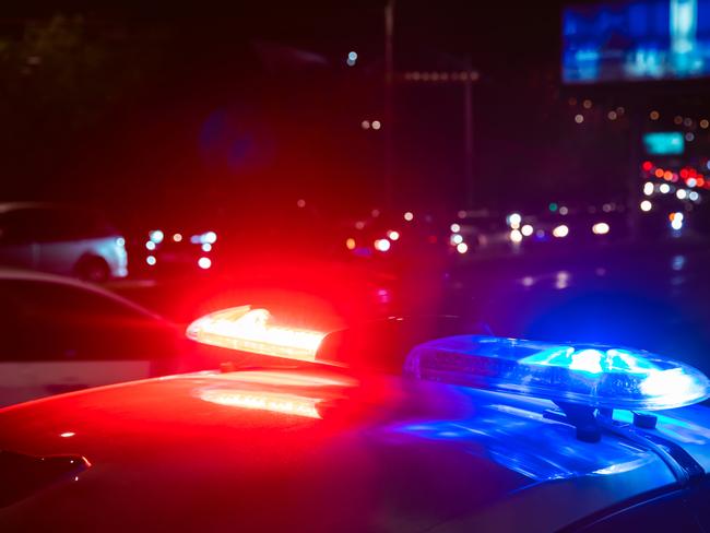 police car in night light street