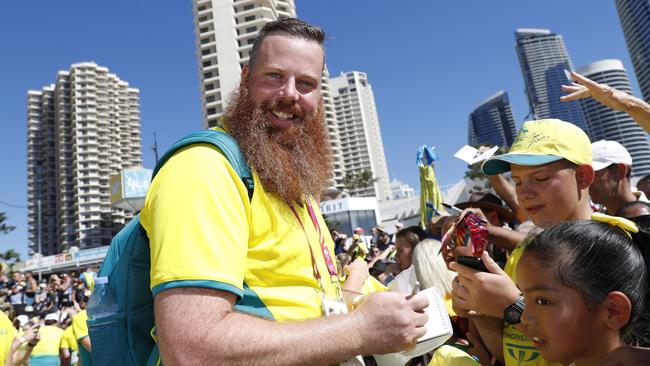 Australian shooter Daniel Repacholi signs autographs following the 2018 Commonwealth Games. Picture: AAP