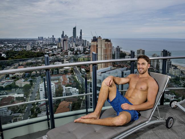 Tyson Mayr, 31, from the Gold Coast has been travelling the world since 2009 after he sold everything and walked away from the office cubicle life to find a life full of adventure & new experiences around the world, while trying to make a difference in the process.Tyson at the Waves pool deck in Broadbeach.  Picture: Jerad Williams