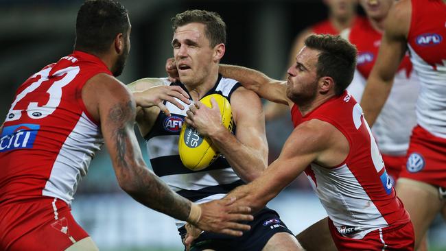 Sydney Swans' Ben McGlynn tackles Geelong's Joel Selwood too high. Picture: Phil Hillyard <a capiid="ca0d72a65c218618e0e8ca07a13f37b3" class="capi-video">Stars cleared by MRP</a>