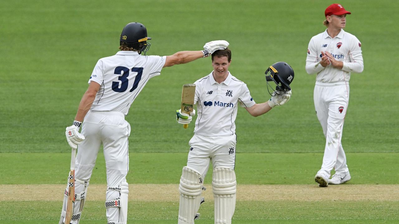 Sam Harper celebrates bringing up his century with a pat on the head from Campbell Kellaway. (Photo by Mark Brake/Getty Images)