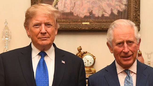 Britain's Prince Charles, Prince of Wales (2nd R) and Britain's Camilla, Duchess of Cornwall (R) meet US President Donald Trump (2nd L) and US First Lady Melania Trump (L) pose for a photograph at Clarence House in central London on December 3, 2019, ahead of the NATO alliance summit. - NATO leaders gather Tuesday for a summit to mark the alliance's 70th anniversary but with leaders feuding and name-calling over money and strategy, the mood is far from festive. (Photo by Victoria Jones / POOL / AFP)