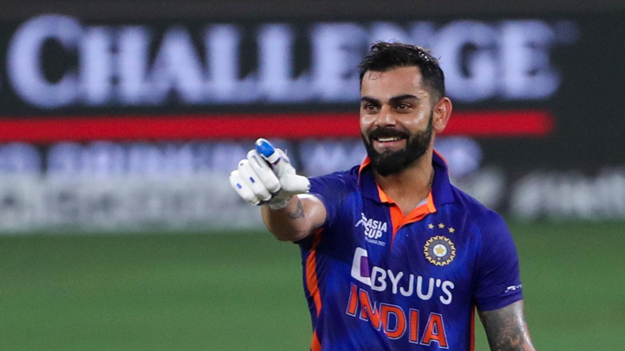 India's Virat Kohli celebrates after scoring a century (100 runs) during the Asia Cup Twenty20 international cricket Super Four match between Afghanistan and India at the Dubai International Cricket Stadium in Dubai on September 8, 2022. (Photo by SURJEET YADAV / AFP)