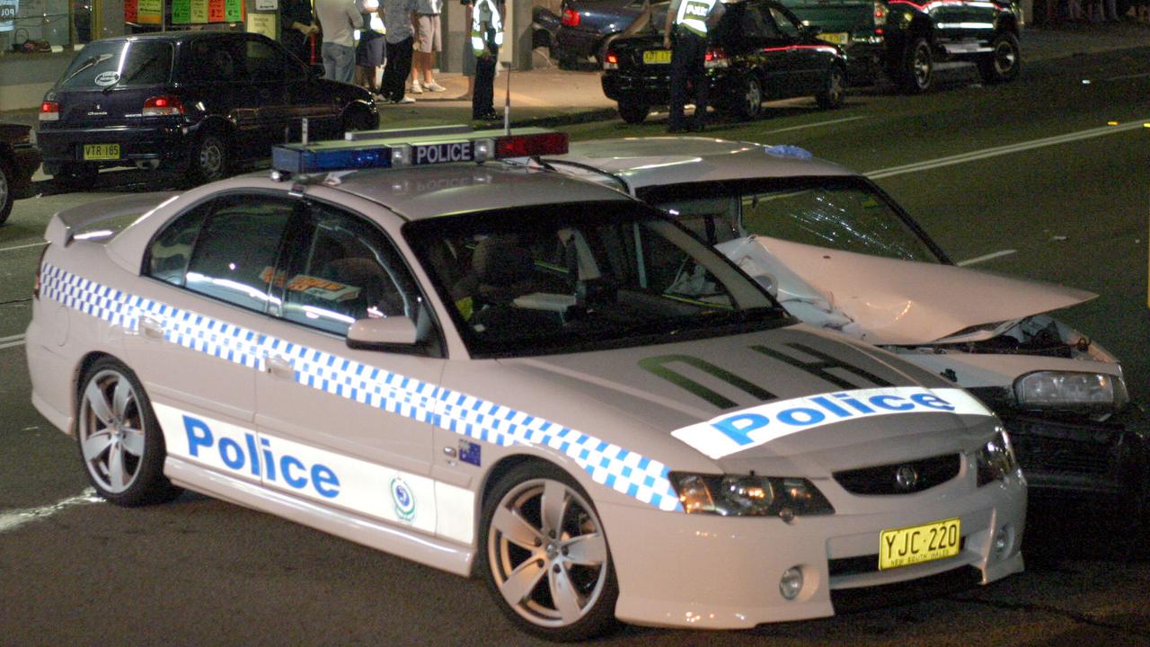 11/4/04. A white VL Commodore crashed whilst being pursued by Police at Rocky Point Road, Sans Souci. It collided with a dark coloured Audi which was parked at the Kerb before  hitting a police car. P