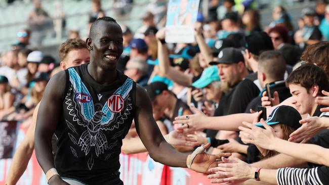 Aliir Aliir celebrates with Power fans. Picture: James Elsby/AFL Photos via Getty Images