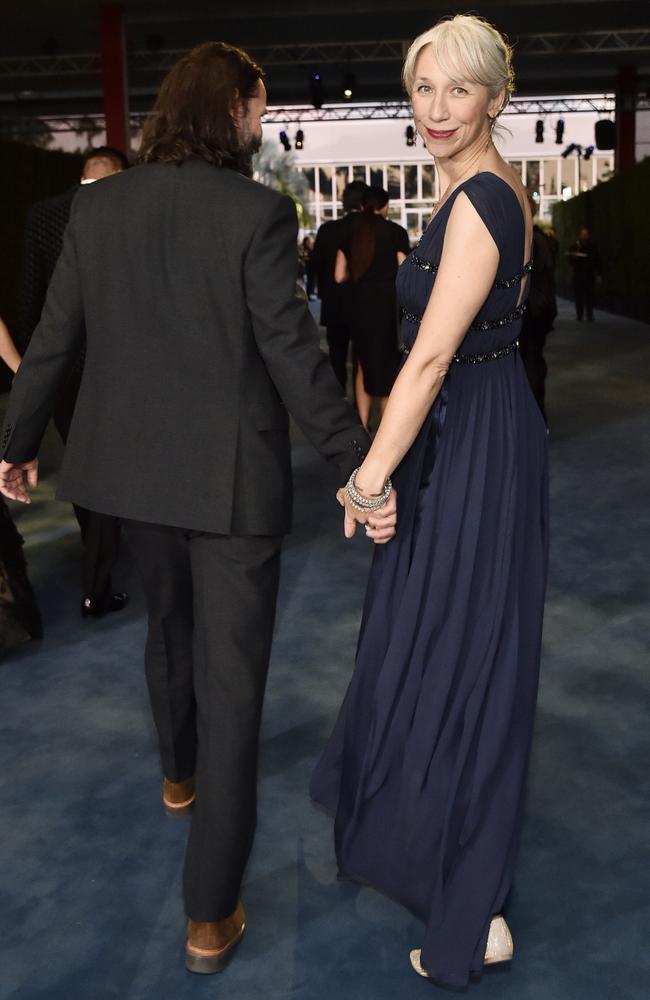 Grant couldn’t wipe the smile off her face as they entered the event hand-in-hand. Picture: Getty Images.