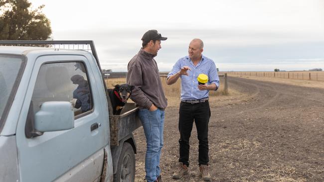 Farmers with dog and water rat.