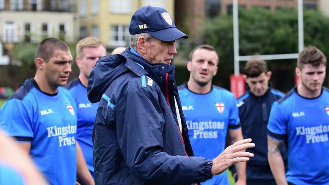 Wayne Bennett talks tactics with the England team at training.