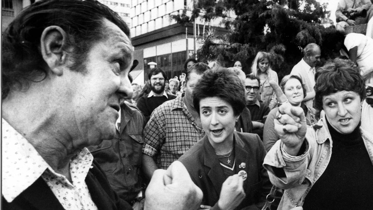 News 22/8/1978. Challenge from a bystander at King George Square for two civil rights protesters who were urging people to vote on the right to march issue. The challenger told them he had fought for the country and would not take part in their protest. Neg/no 35-P-4518-5 Scanned September/2009 The Courier-Mail Photo Archive