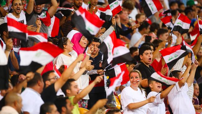 Supporters cheer on Iraq during the Asian Cup match against Japan at Suncorp Stadium.