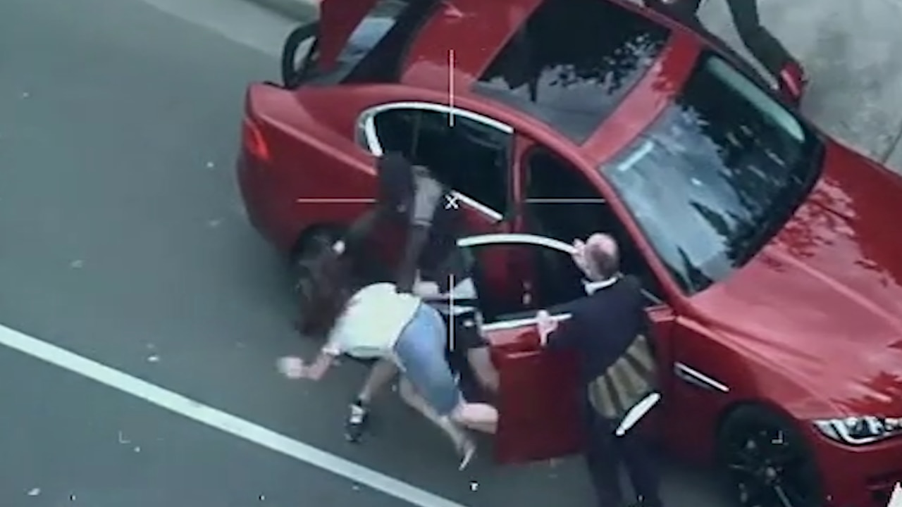 Footage shows the woman being thrown to the ground by a man during a police chase.