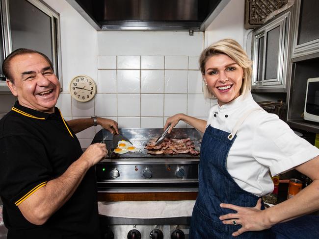 Courtney Roulston cooking breakfast with Club York CE Rocky Massaria at The Station drop-in centre in Sydney. Picture: Julian Andrews