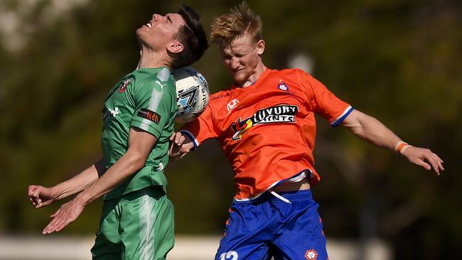 Joel Alwright, of Campbelltown City, and Shaun Carlos, of Lions FC, compete for the ball in the Australian NPL elimination final at Lions Stadium. Picture: Albert Perez/Getty Images