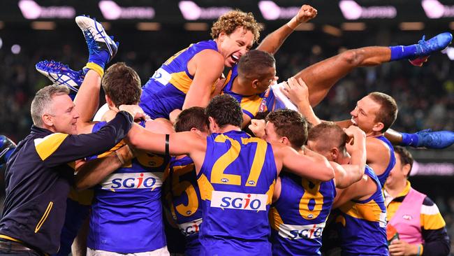 Drew Petrie (far right) celebrate’s West Coast’s extra-time win against Port Adelaide last week. Picture: AAP