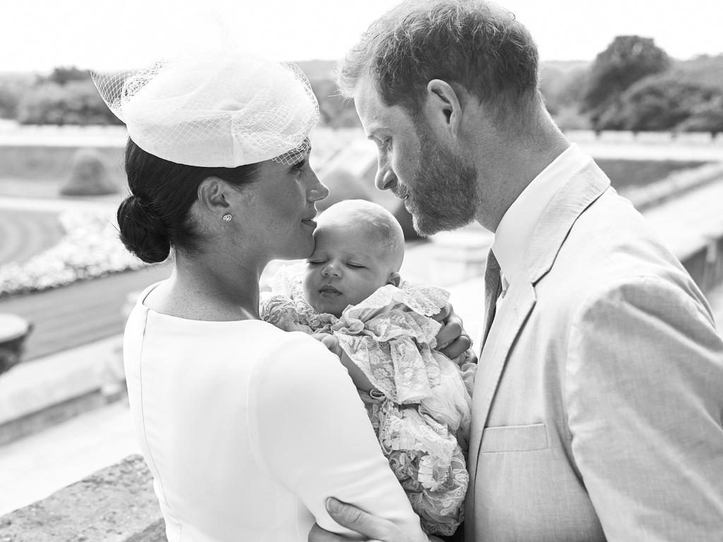 The royal couple, with Archie, on his christening day. Picture: AFP