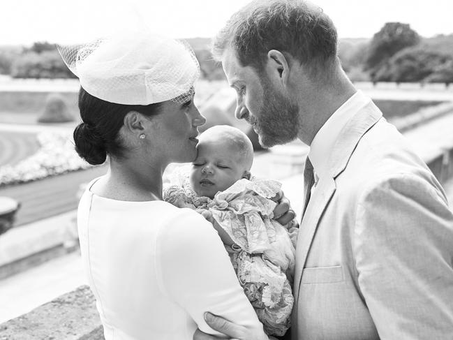 The royal couple, with Archie, on his christening day. Picture: AFP